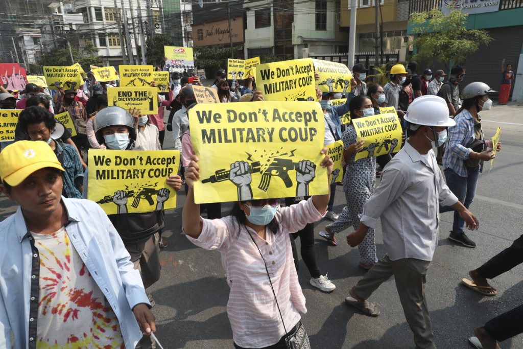 Myanmar citizens protesting against the military coup in Yangon in 2021 — the crackdown on peaceful protesters drove millions toward armed resistance