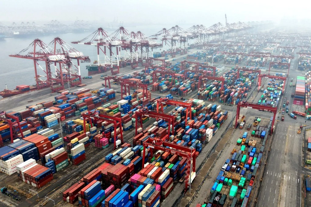 Shipping containers at a Chinese port — China's exports to the US fell 20% in 2025 but rose sharply elsewhere, with Africa up 25.8%, Southeast Asia 13.4%, and the EU 8.4%, reflecting a fundamental restructuring of global trade flows