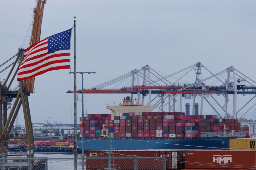 Shipping containers piled at a US port amid the US-China trade war — tariffs reached 145% on Chinese goods and 125% on US goods in April 2025 before both sides agreed to a truce