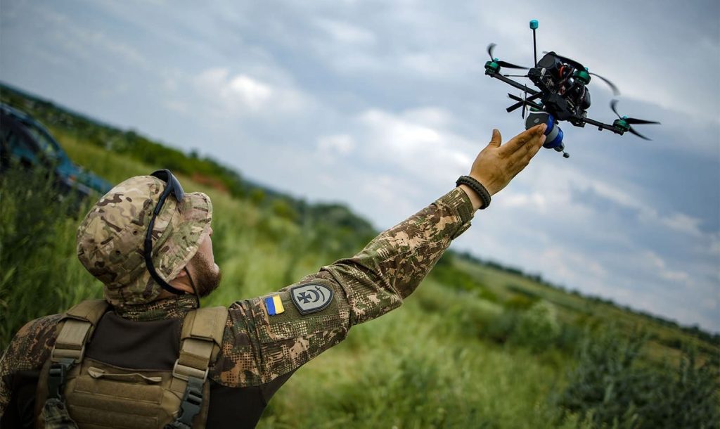 A Ukrainian FPV drone operator controlling a combat mission from miles behind the front line — drones and ground robots allow soldiers to fight without physical exposure to the most lethal zones