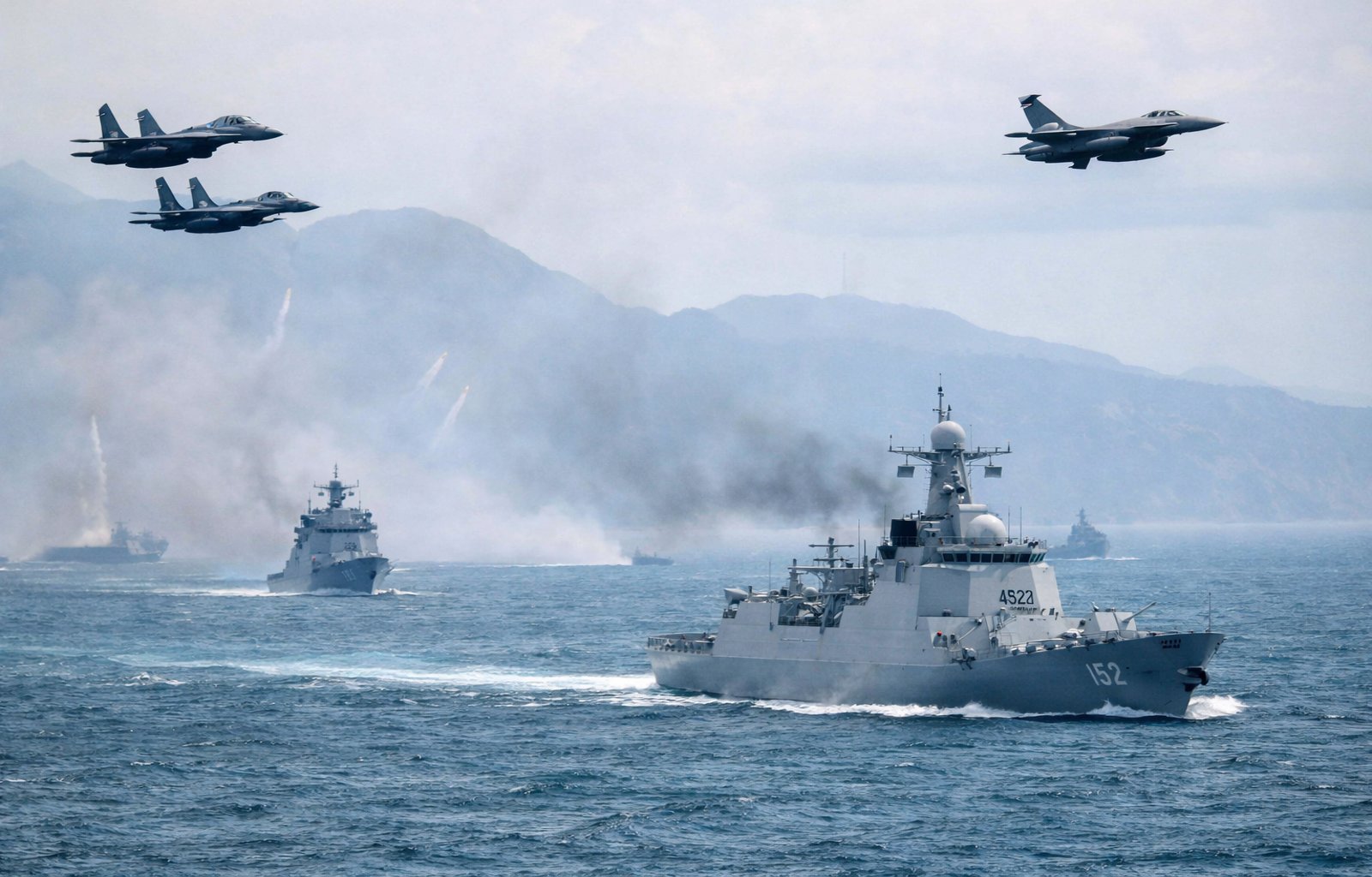 A People's Liberation Army Navy warship operating in the South China Sea — China's military buildup in the region has accelerated dramatically in 2025 and 2026
